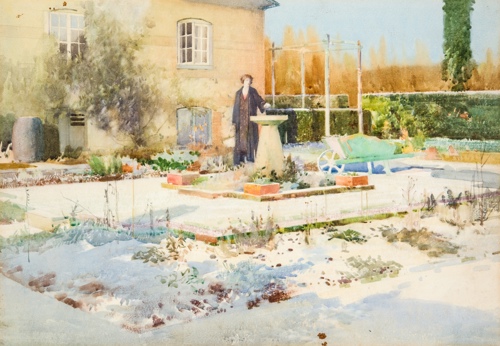 A woman stands by a sundial in fron the artst fred Appleyard's house
