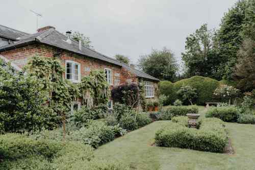 A Hampshire brick cottage covered in wisteria